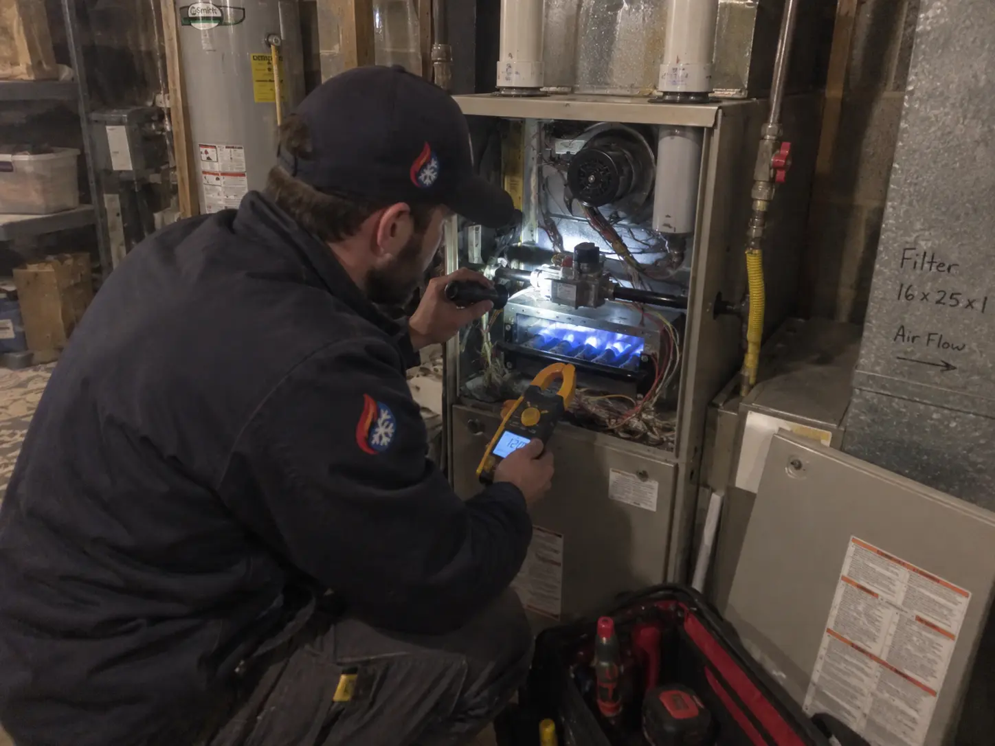 Technician explaining furnace findings to a homeowner